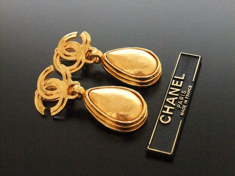Authentic vintage Chanel earrings gold CC swing drop