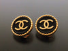 Authentic vintage Chanel earrings gold CC black button round