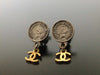 Authentic vintage Chanel earrings COCO medal swing gold CC