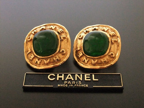 Authentic vintage Chanel earrings gold logo green glass stone