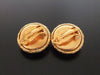 Authentic vintage Chanel earrings gold CC black plastic round