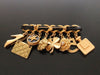 Authentic vintage Chanel pin brooch gold CC 8 icon charms rare