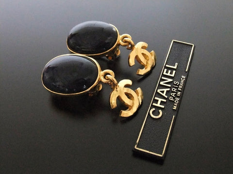 Authentic vintage Chanel earrings navy blue stone gold swing CC