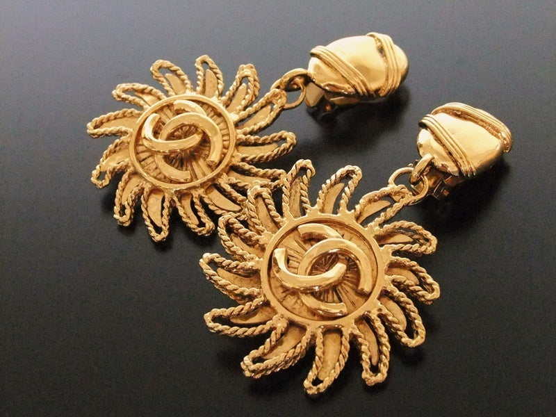Authentic vintage Chanel earrings gold swing CC dangle huge sun
