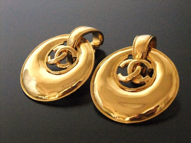 Authentic vintage Chanel earrings gold swing disc CC dangle large