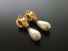 Authentic vintage Chanel earrings gold CC swing pearl drop dangle