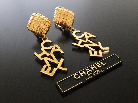 Authentic vintage Chanel earrings gold swing logo dangle huge