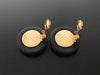 Authentic vintage Chanel earrings white logo black round