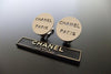 Authentic vintage Chanel earrings metallic color logo