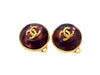Vintage Chanel earrings CC logo purple glass stone