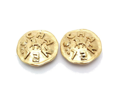 Authentic vintage Chanel earrings gold logo horse round