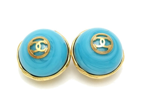 Authentic vintage Chanel earrings gold CC light blue glass stone