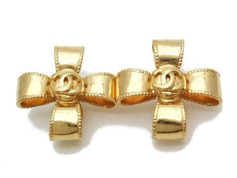 Authentic vintage Chanel earrings gold CC cross ribbon