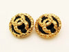 Authentic vintage Chanel earrings gold CC black plastic stone round