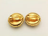 Authentic vintage Chanel earrings gold CC black plastic stone round