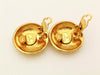 Authentic vintage Chanel earrings gold logo round clip on