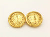 Authentic vintage Chanel earrings gold rue cambon logo medal round