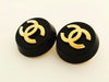 Authentic vintage Chanel earrings gold CC black plastic round