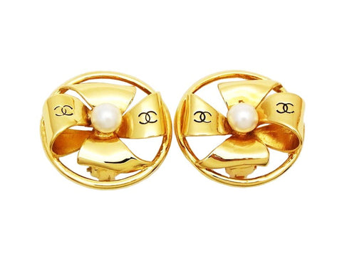 Authentic vintage Chanel earrings gold pinwheel CC logo pearl round