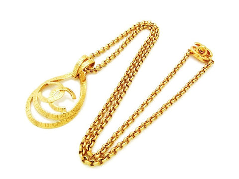 Authentic vintage Chanel necklace chain gold logo ribbon CC pendant
