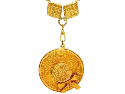Vintage Chanel necklace straw hat